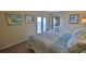 Bedroom with ocean view and sliding glass door access to balcony at 5207 S Atlantic Ave # 1226, New Smyrna Beach, FL 32169