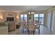 Bright dining area with glass table and ocean view at 5207 S Atlantic Ave # 1226, New Smyrna Beach, FL 32169
