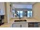 Kitchen with ocean view and stainless steel sink at 5207 S Atlantic Ave # 1226, New Smyrna Beach, FL 32169