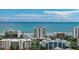 Aerial view of beachfront property, showcasing ocean views and multiple buildings at 5207 S Atlantic Ave # 1226, New Smyrna Beach, FL 32169
