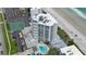Aerial view of oceanfront high rise building with pool and beach access at 5207 S Atlantic Ave # 1226, New Smyrna Beach, FL 32169