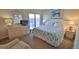 King-size bed and dresser with ocean view at 5207 S Atlantic Ave # 1226, New Smyrna Beach, FL 32169