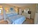 Main bedroom with a comfortable bed and dresser at 5207 S Atlantic Ave # 1226, New Smyrna Beach, FL 32169