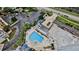 Community pool and spa, surrounded by lounge chairs and landscaping at 5207 S Atlantic Ave # 1226, New Smyrna Beach, FL 32169