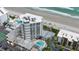 Aerial view of oceanfront high rise building with pool and beach access at 5207 S Atlantic Ave # 1226, New Smyrna Beach, FL 32169