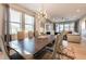 Bright dining room with large table and modern chandelier at 341 Burma St, Kissimmee, FL 34747