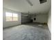Attached garage with concrete floor and overhead door at 3260 Roseville Dr, Apopka, FL 32712