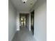 Long hallway with tile floors connecting various rooms of the home at 3260 Roseville Dr, Apopka, FL 32712