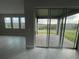 Sliding glass doors open to a paved patio overlooking a grassy backyard at 3260 Roseville Dr, Apopka, FL 32712