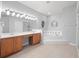 Elegant bathroom with double vanity, soaking tub, and updated fixtures at 25013 Derby Dr, Sorrento, FL 32776