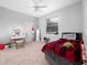 Bedroom with a full-size bed and neutral color palette at 25013 Derby Dr, Sorrento, FL 32776