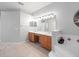 Primary bathroom with double vanities and a garden tub at 25013 Derby Dr, Sorrento, FL 32776