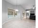 Bright dining room with tile floors and view of the pool at 25013 Derby Dr, Sorrento, FL 32776