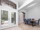 Dining room with French doors and a view of the backyard at 25013 Derby Dr, Sorrento, FL 32776