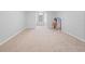 Large bedroom with neutral carpeting and ample space at 25013 Derby Dr, Sorrento, FL 32776