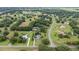 Aerial view showcasing the property's serene location and surrounding landscape at 25013 Derby Dr, Sorrento, FL 32776