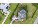 Bird's-eye view of home, pool, and surrounding neighborhood at 25013 Derby Dr, Sorrento, FL 32776