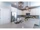 Modern kitchen with stainless steel appliances and white cabinets at 992 Jetway St, Orange City, FL 32763