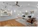 Bright and airy living room with hardwood floors and open concept kitchen at 1616 E Marks St, Orlando, FL 32803