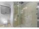 Bathroom featuring toilet and glass shower with marble surround at 1616 E Marks St, Orlando, FL 32803