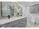 Elegant bathroom with double vanity and a large mirror at 1616 E Marks St, Orlando, FL 32803