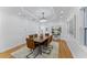 Bright dining room with hardwood floors, chandelier, and seating for six at 1616 E Marks St, Orlando, FL 32803
