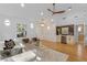 Open living space with hardwood floors, built-in bar, and comfortable seating at 1616 E Marks St, Orlando, FL 32803