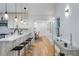 Open concept kitchen with breakfast bar, seating and view to dining room at 1616 E Marks St, Orlando, FL 32803