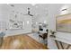 Open living room with hardwood floors and a stylish modern aesthetic at 1616 E Marks St, Orlando, FL 32803