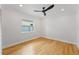 Spacious bedroom with hardwood floors and a ceiling fan at 1616 E Marks St, Orlando, FL 32803