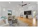 Open living area showcasing hardwood floors, a built-in bar and stylish furniture at 1616 E Marks St, Orlando, FL 32803