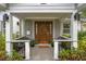 Inviting front porch with a stylish door and ample seating at 1616 E Marks St, Orlando, FL 32803