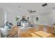 Large primary bedroom with hardwood floors and multiple windows at 1616 E Marks St, Orlando, FL 32803