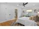 Bright bedroom with ensuite bathroom, hardwood floors, and ceiling fan at 1616 E Marks St, Orlando, FL 32803