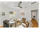 Bright home office features a glass desk, comfortable seating, and hardwood floors at 1616 E Marks St, Orlando, FL 32803