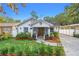Renovated craftsman home with a well-manicured lawn and paver driveway at 1616 E Marks St, Orlando, FL 32803