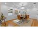 Formal dining room with hardwood floors, decorative art and chandelier at 1616 E Marks St, Orlando, FL 32803