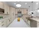Renovated kitchen with marble countertops, stainless steel appliances, and custom cabinetry at 1616 E Marks St, Orlando, FL 32803