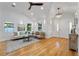 Bright living room with hardwood floors, comfy seating, and stylish decor at 1616 E Marks St, Orlando, FL 32803