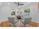 Home office with hardwood floors, two armchairs, and a work desk at 1616 E Marks St, Orlando, FL 32803