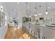 Open concept kitchen with breakfast bar and view into living room at 1616 E Marks St, Orlando, FL 32803