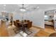 Elegant dining room featuring hardwood floors, chandelier and view to kitchen at 1616 E Marks St, Orlando, FL 32803