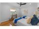 Bedroom with twin beds, hardwood floors, and a ceiling fan at 1616 E Marks St, Orlando, FL 32803