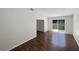 Living room with wood-look floors and sliding glass doors at 213 Deborah Ave, Leesburg, FL 34748