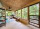 Relaxing screened porch with seating and grill, overlooking lush greenery at 3016 Riverside Park Rd, Orlando, FL 32810