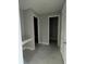 Bright hallway with access to multiple rooms and bathrooms at 3252 Roseville Dr, Apopka, FL 32712