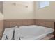 Bathroom with corner garden tub and tile surround at 2929 Carrickton Cir, Orlando, FL 32824