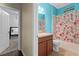 Bathroom with shower/tub combo, vanity, and floral shower curtain at 2929 Carrickton Cir, Orlando, FL 32824