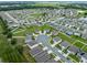 Aerial view of a residential neighborhood showcasing various houses and landscaping at 821 Sun Burst Rd, Winter Haven, FL 33880