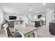 Bright dining area with a table and four chairs at 821 Sun Burst Rd, Winter Haven, FL 33880